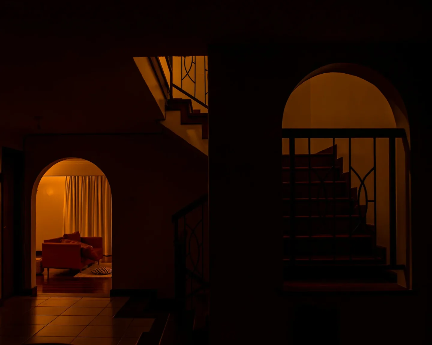 Interior Staircase And Doorway With Warm Lighting