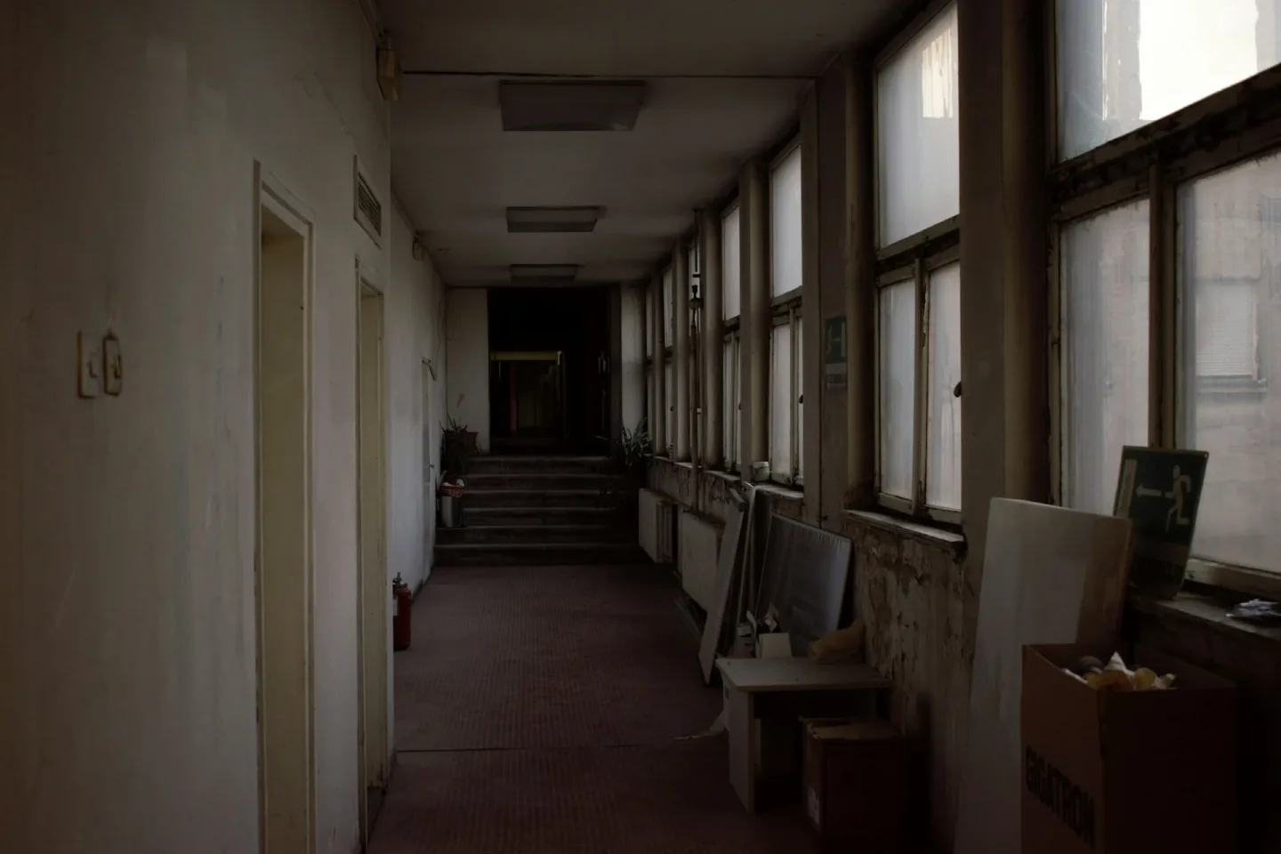 A Long Hallway With A Bunch Of Windows